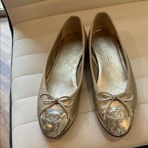 CHANEL Gold Ballet Flats with Bow Accent